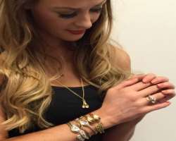 She is a registered nurse and a jewelry designer.